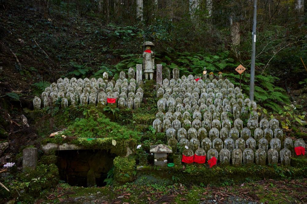 Hundreds of moss-covered Jizō statues at Iwayaji Temple