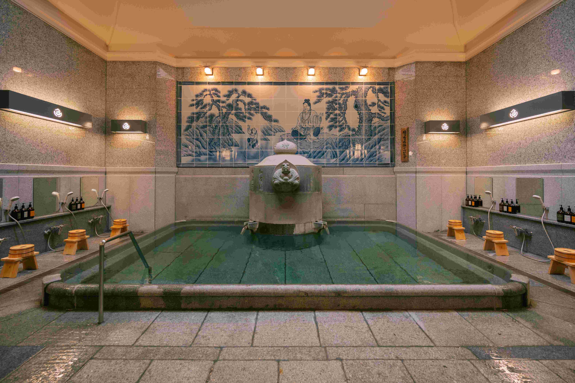 Kami no Yu bathing room at Dogo Onsen with tiled mural and stone bath